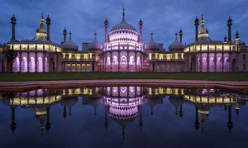 The Royal Pavilion at night with some water in the front of the shot